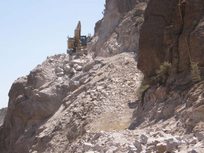 Heavy equipment clings to the mountainside in the Devil's Canyon between Superior and Miami, AZ.