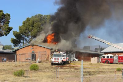 Fire crews from San Manuel Fire Department work to extinguish a fire at Avenue B Elementary School. Photo by Jennifer Carnes