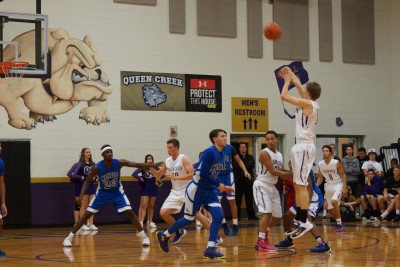 Bulldogs' forward Kade Parks (15) launches a three-pointer in Tuesday's loss. 