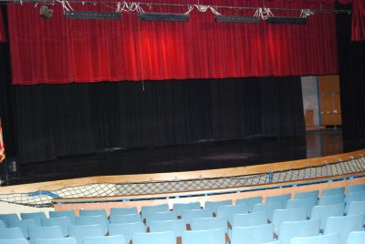 Beautiful red and blue curtains grace the stage at the San Manuel auditorium.