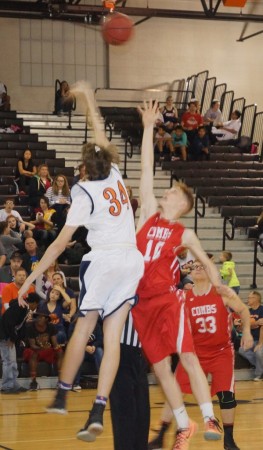 Poston Butte's Tyson Berringer and Combs' Clayten McCarthy battle for the opening tip-off of Friday's game.