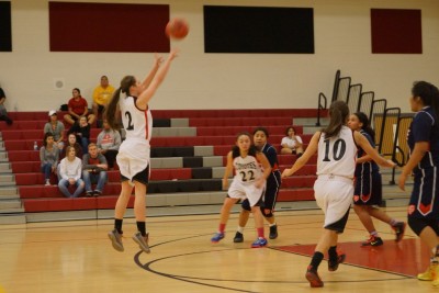 Lady Yotes' Landry Armstrong launches a three-pointer against Coolidge on Jan, 27.