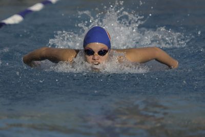 Darien Apuron sets a new school record in the 100Fly.  Photo courtesy Apuron Photography