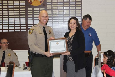 Pinal County Sheriff Paul Babeu presented an official commendation to Pilar Clark.