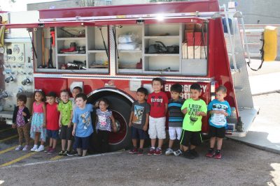 Adorable kids in front of the Mammoth Fire Truck