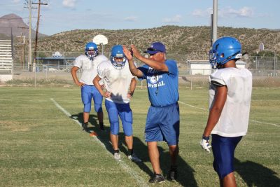 Hayden football coach John Estrada works with his team, readying them for the coming home game against Williams.