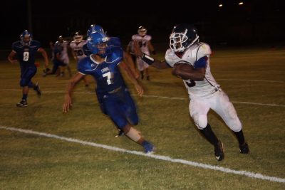 Hayden’s Brandon Cruz (#7) races to tackle NFL Yet’s Tyraill Carrethers (#5).