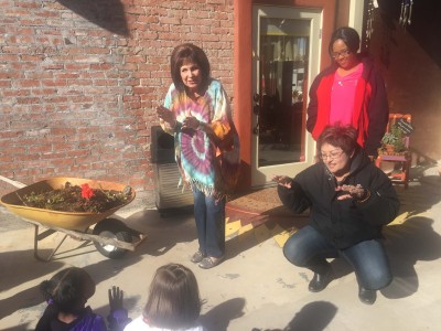 Willa Ficcara, owner of the  SunFlour Market, sings songs to visiting preschoolers.