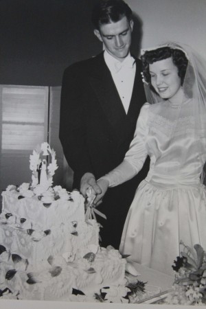 Mr. and Mrs. Jerman cutting the cake on their wedding day.