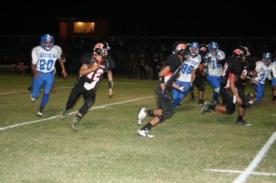 Panthers' QB Nicolaus Cruz (12) finds running room on the outside against the Lobos during Friday's Homecoming win.