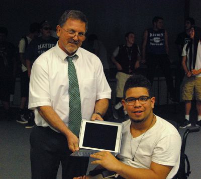 Jeff Gregorich presents Santiago Pina with the first iPad.
