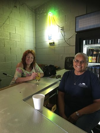 Sylvia Longoria bartender helps a local patron during happy hour.