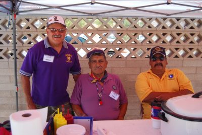 Volunteers from the San Pedro Valley Lions Club grilled up hot dogs for kids at the Mammoth Pool.