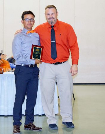 Manny Ruiz Award winner Jose Lira (left) and Superior HS Principal William Duarte (right).