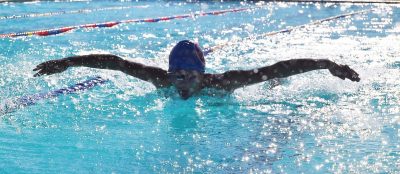 Michael Primero swims the Butterfly in the 200 IM. Photo by Elyssia Aguilar, SMHS