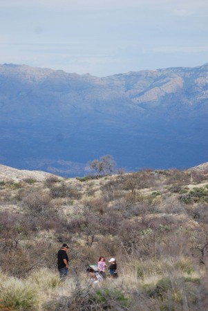 A family hikes on one of the nature trails at Oracle State Park.