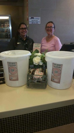 Queen Creek Store Manager Alicia Morain Provides Coffee Grounds To Simonton Garden Coordinator Sherri Crosslin.