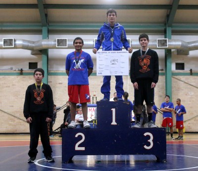 San Manuel's Adrian Romero stands on the podium in second place.
