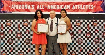 San Manuel Softball All-American players Lyana Waddell (left) and Angela Navarro (right) with chairperson Tot Workman (center).