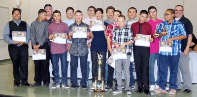 The Superior Jr High baseball team shows off its championship trophy during last week's Sports Awards Banquet.