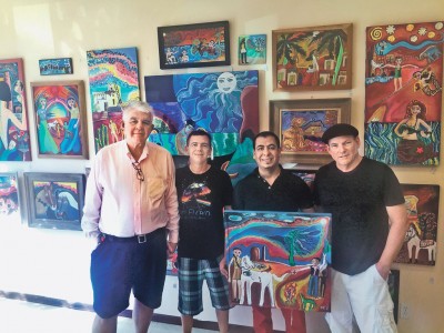 Owners Boonie and Andre LeBlanc with two local artists.