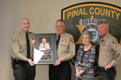 Sheriff Paul Babeu presents the Chaplain of the Year Award to James Stephens who is pictured with his wife Karen and PCSO Chief Deputy Steve Henry.