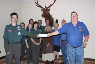 Receiving the grant on behalf of the local Boy Scout Troop is Eagle Scout Alec Newman, front left. Tom Miller, front right, presents the check. Pictured with Alec and Tom are from left: middle, Cheryl Hexum, Alexis Smith, Cailin Belford, Jane Newman, Ruth Wentworth (Elks Trustee), Dave Martin (Elks Secretary); back, Michael Garcia, Terry Newman and Tom Belford.Jennifer Carnes | Miner