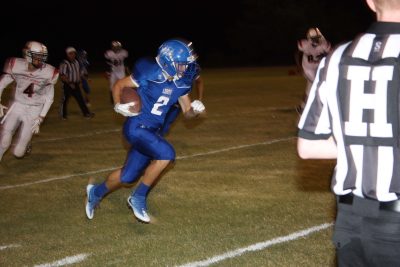 Hayden's Sr. running back rushes during the homecoming victory over Valley Lutheran.