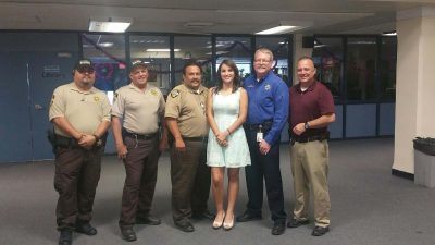 Salutatorian Angelica Cabrera is pictured with several members of the Gila County Sheriff's Office. Angelica was presented  a Law Related Education award.