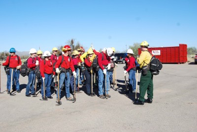 Students receive instruction from wildland firefighters.