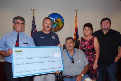 Pinal County Supervisor Pete Rios, left, makes a donation of $20,000 to the Hayden Senior Center which serves senior citizens from Superior to SaddleBrooke and all points in between.
