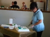 Annie Hinojos cutting cake